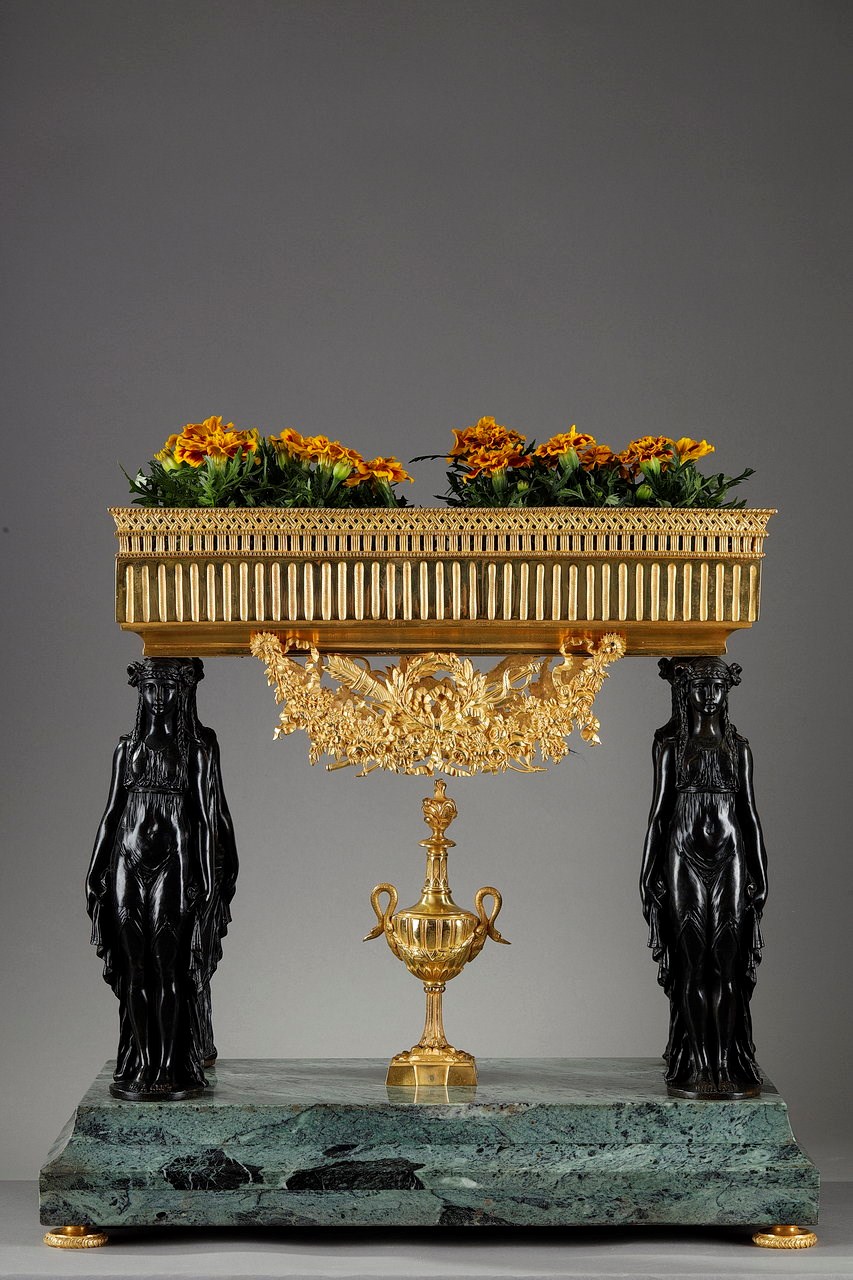 A centerpiece with Empire style caryatids